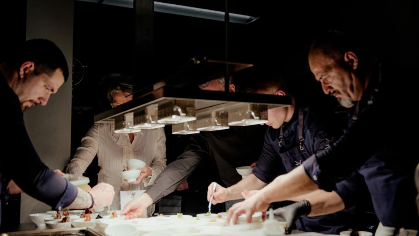 Chefs plating at the pass