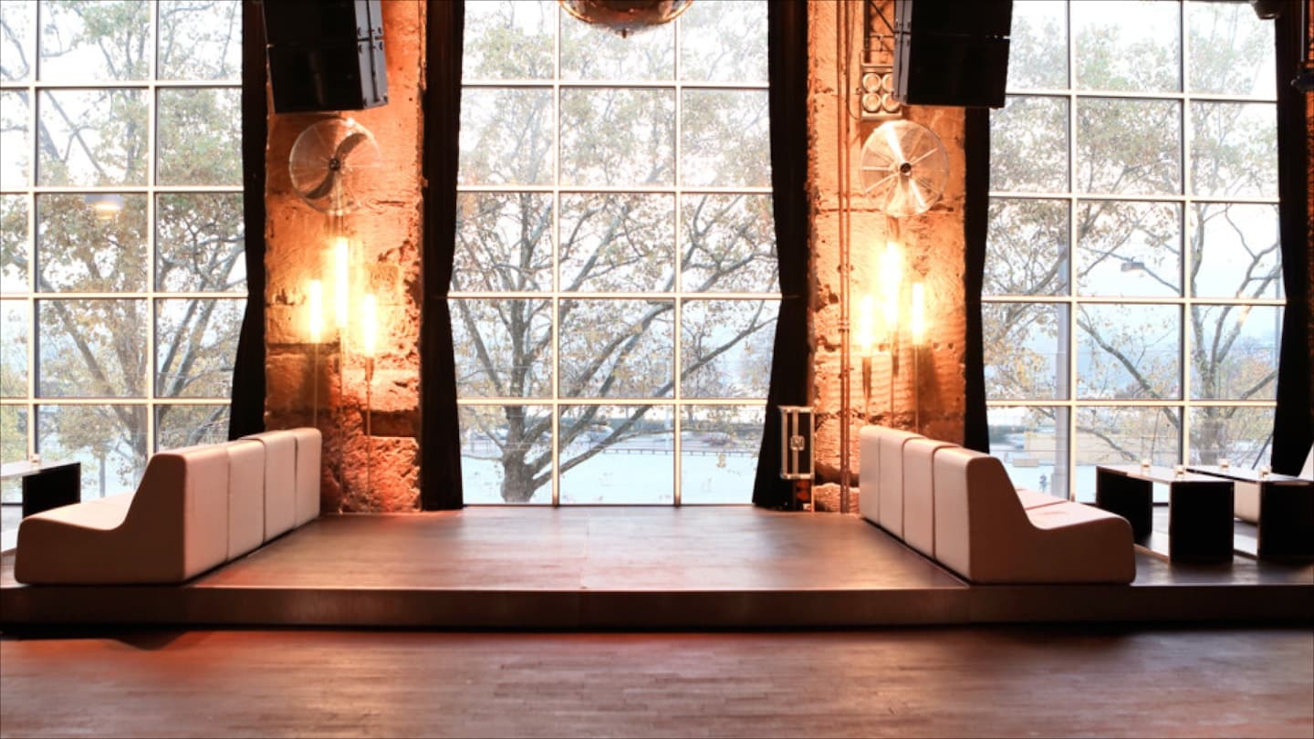 The Palais Mascotte main room, stage and lake windows