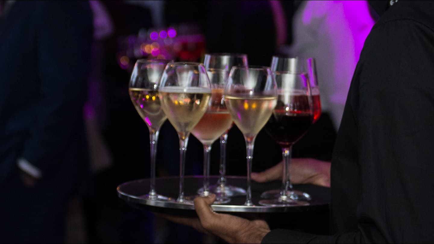 A tray of apéro glasses at a festival reception