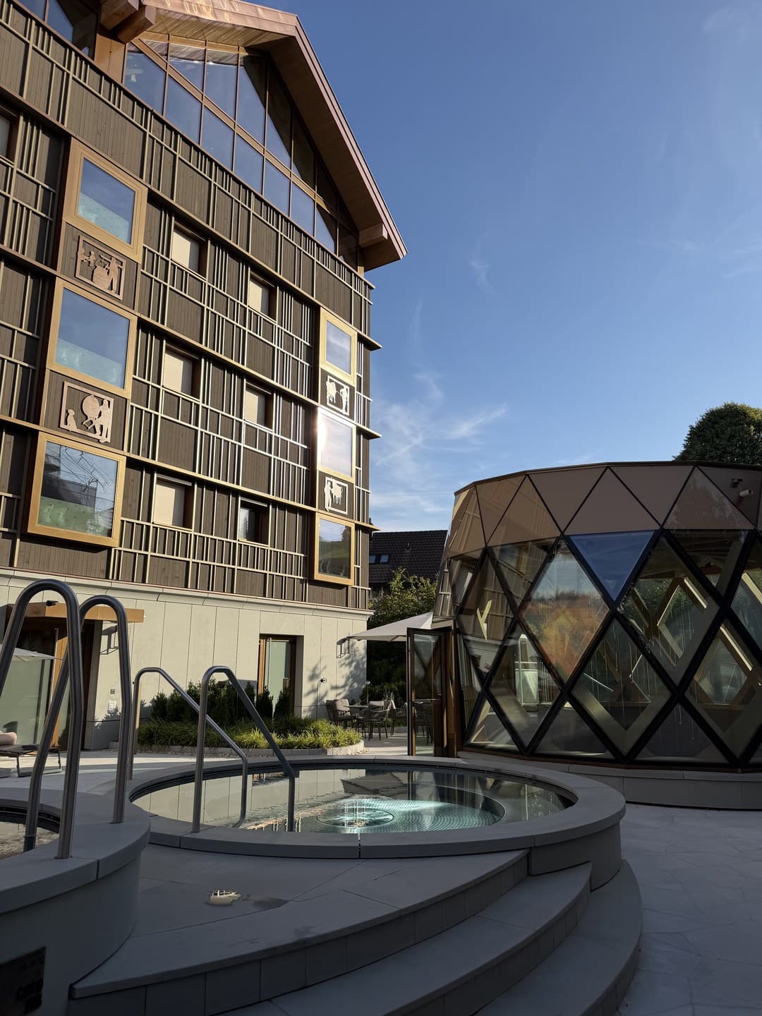 Part of the outdoor spa area, with the faceted glass pavilion