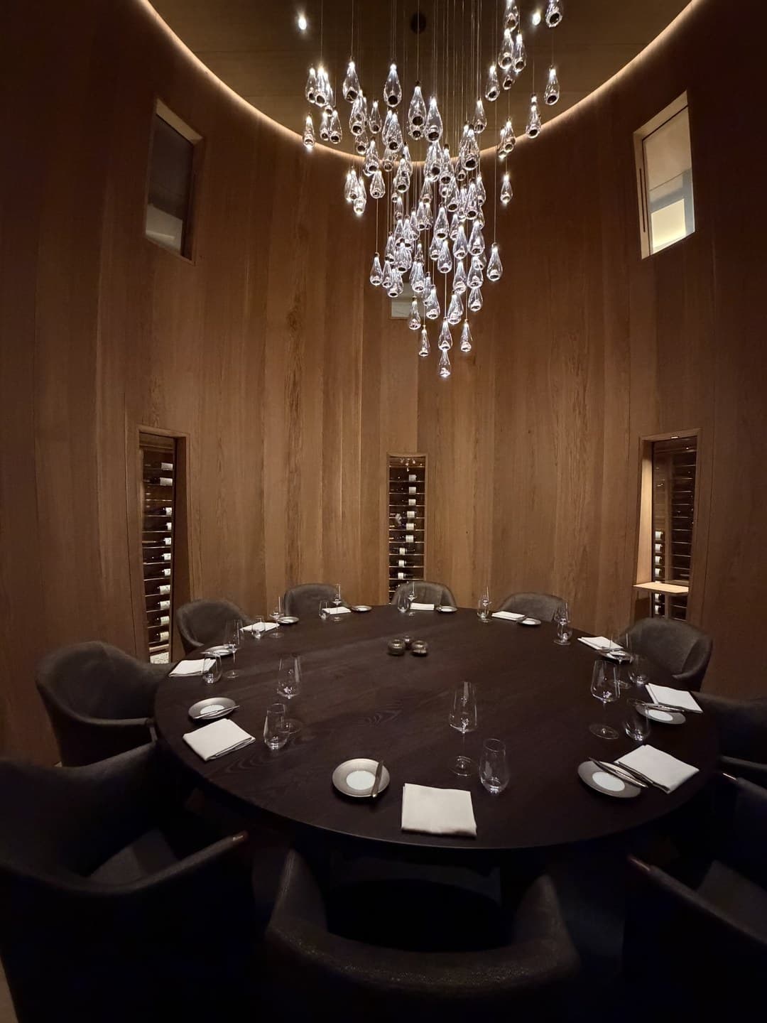 A round table in a barrel-shaped room in the wine cellar