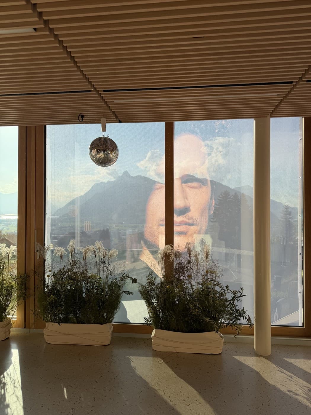 Magdalena's dining room at dusk, a disco ball and the valley reflected in the glass