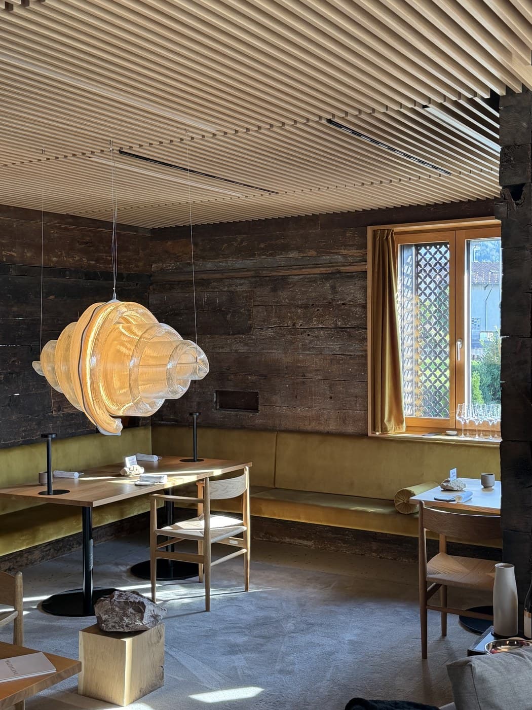 Magdalena's outdoor terrace, with wood sculptures and a view toward the Rigi